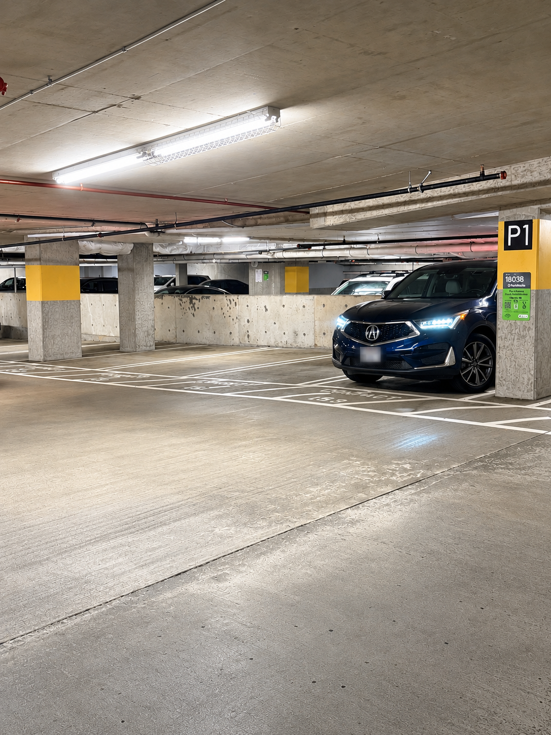 Indoor Brio Garage parking area with open spaces and ParkMobile zone 18038.