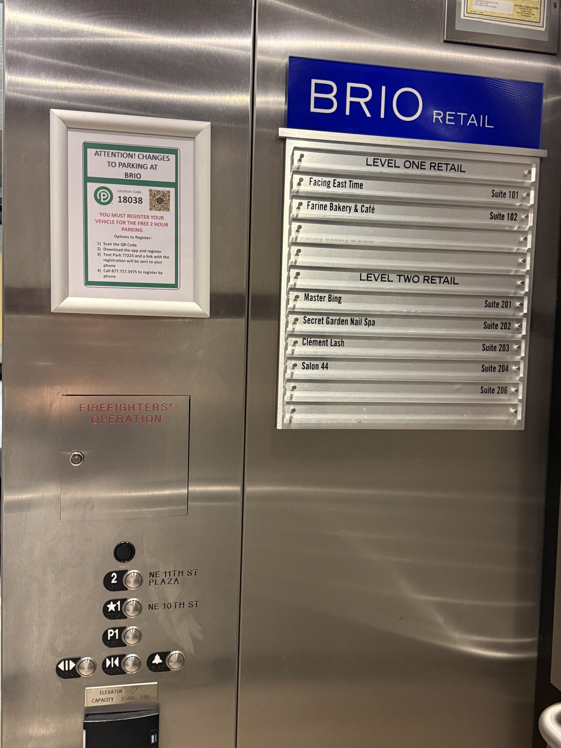 Brio Retail Elevator controls showing Level 1 NE 10th Street and Clement Lash Suite 203.